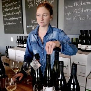 Mackenzie Brisbois, Winemaker at Trail Estates Winery talks about wine at the tasting bar